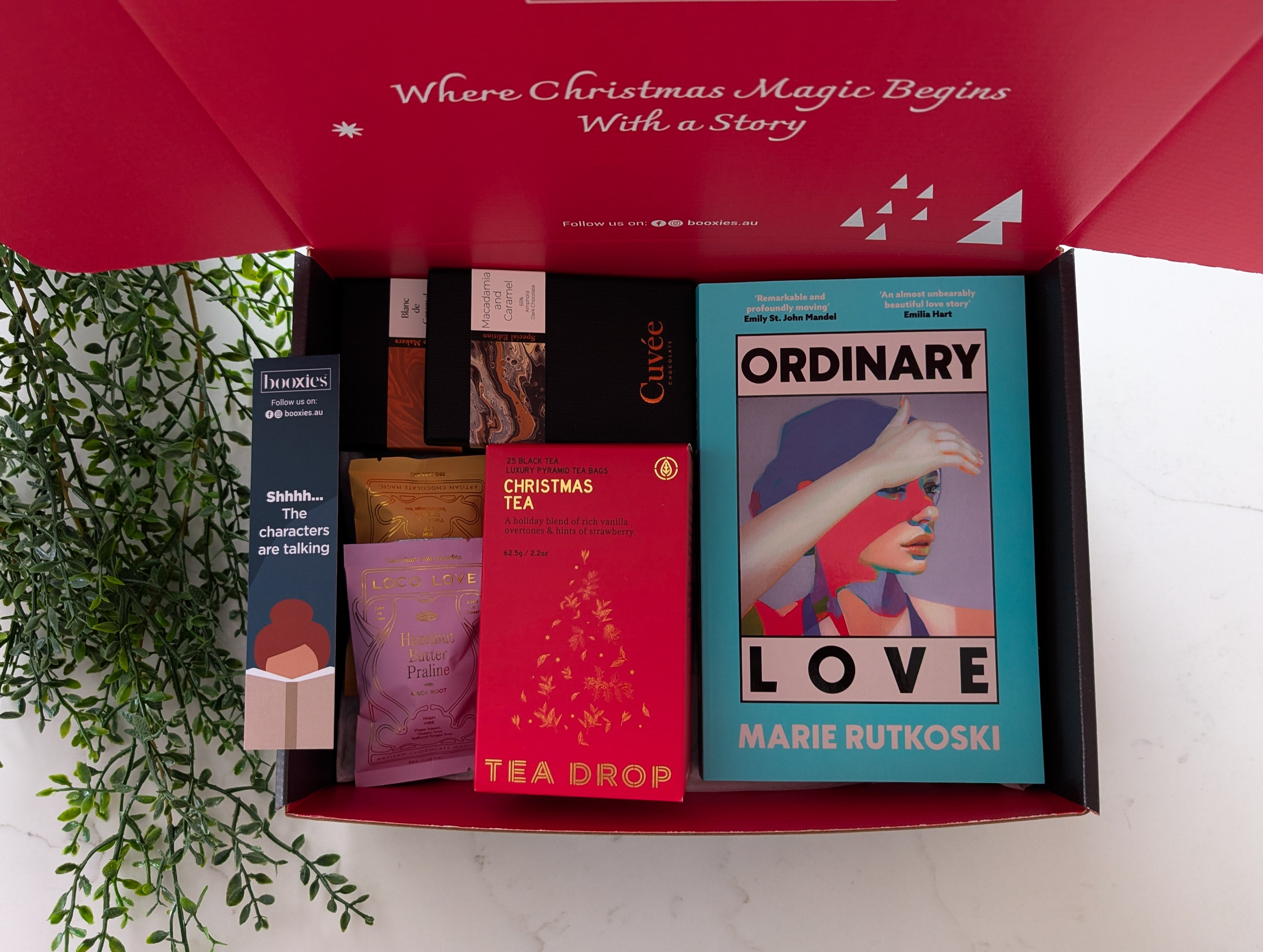 Book and tea set packaging with 'Ordinary Love' book visible