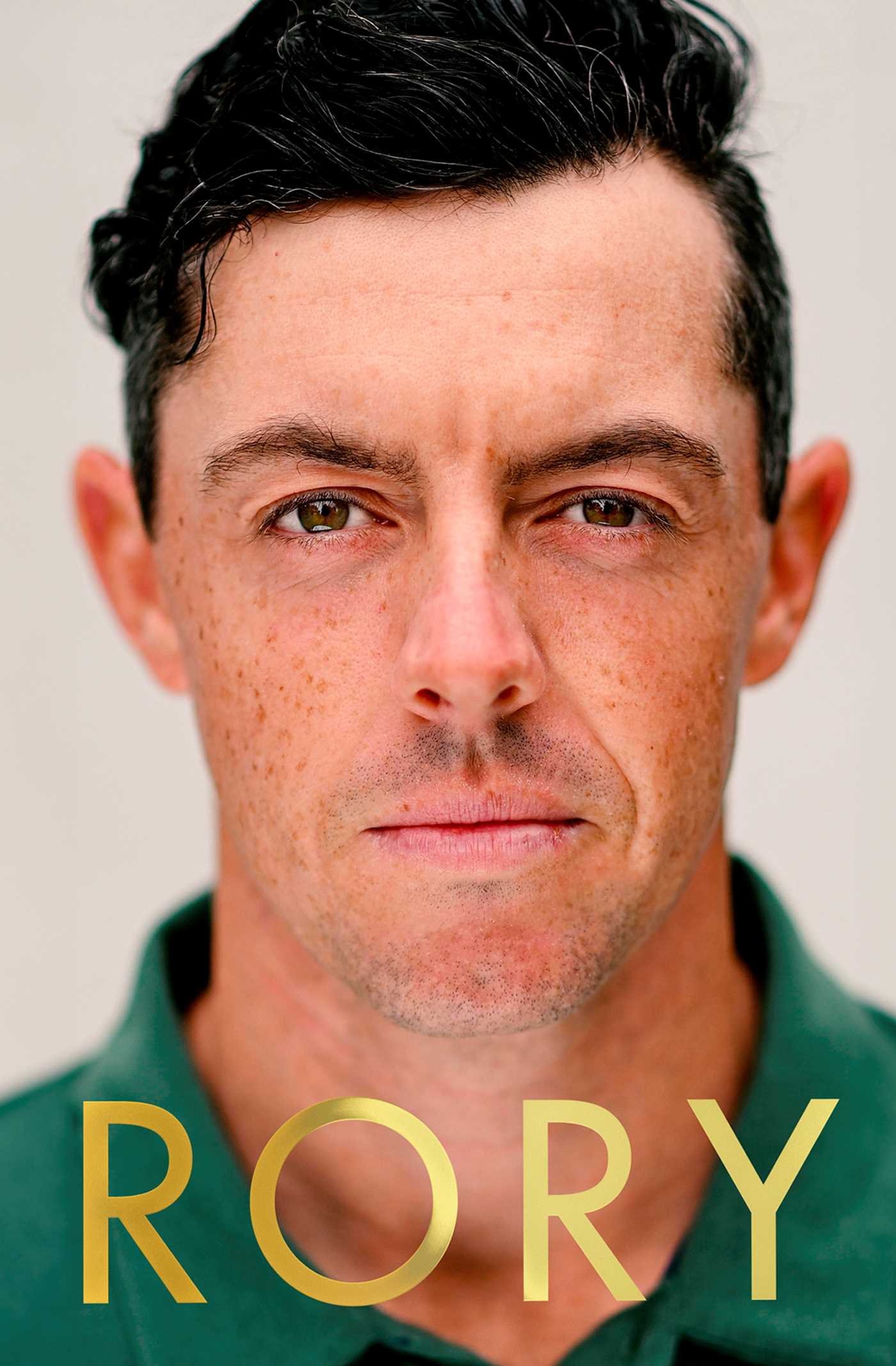 Close-up of a person with 'RORY' text in gold at the bottom