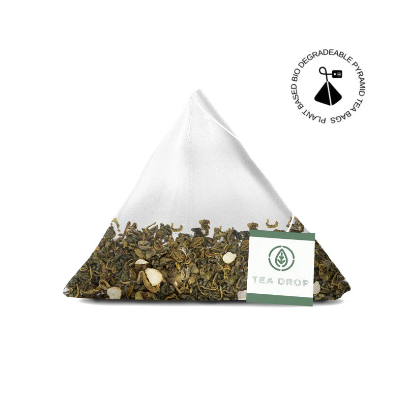 Tea bag with visible tea leaves and a brand label on a white background