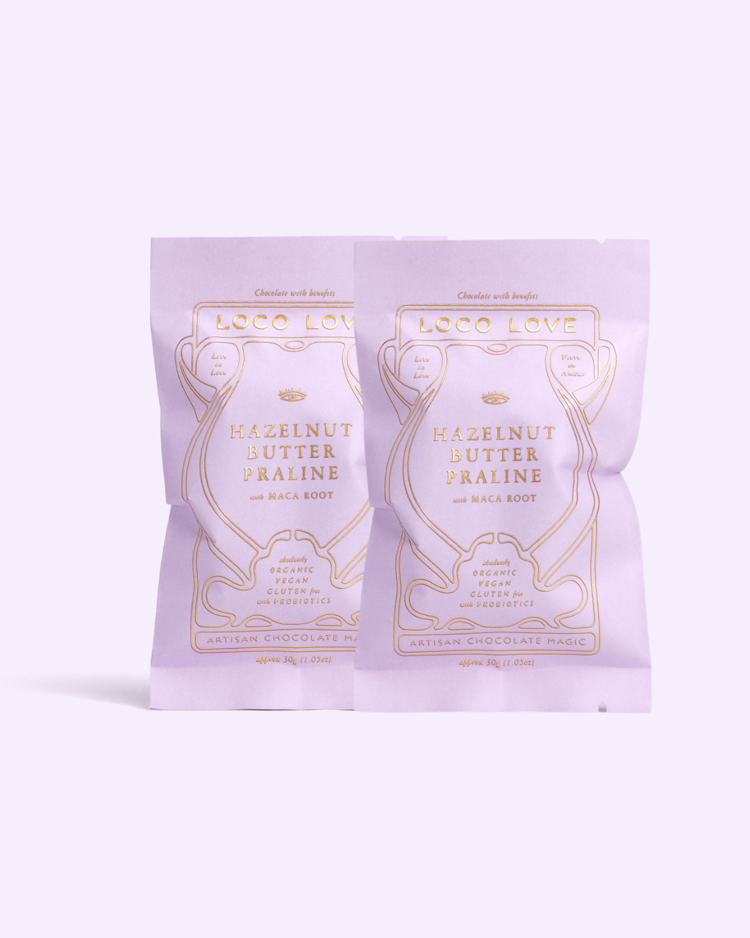 Two hazelnut butter praline chocolate from Loco Love with gold text on a white background