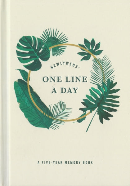 Memory book titled 'One Line a Day' with leaf design on a beige background
